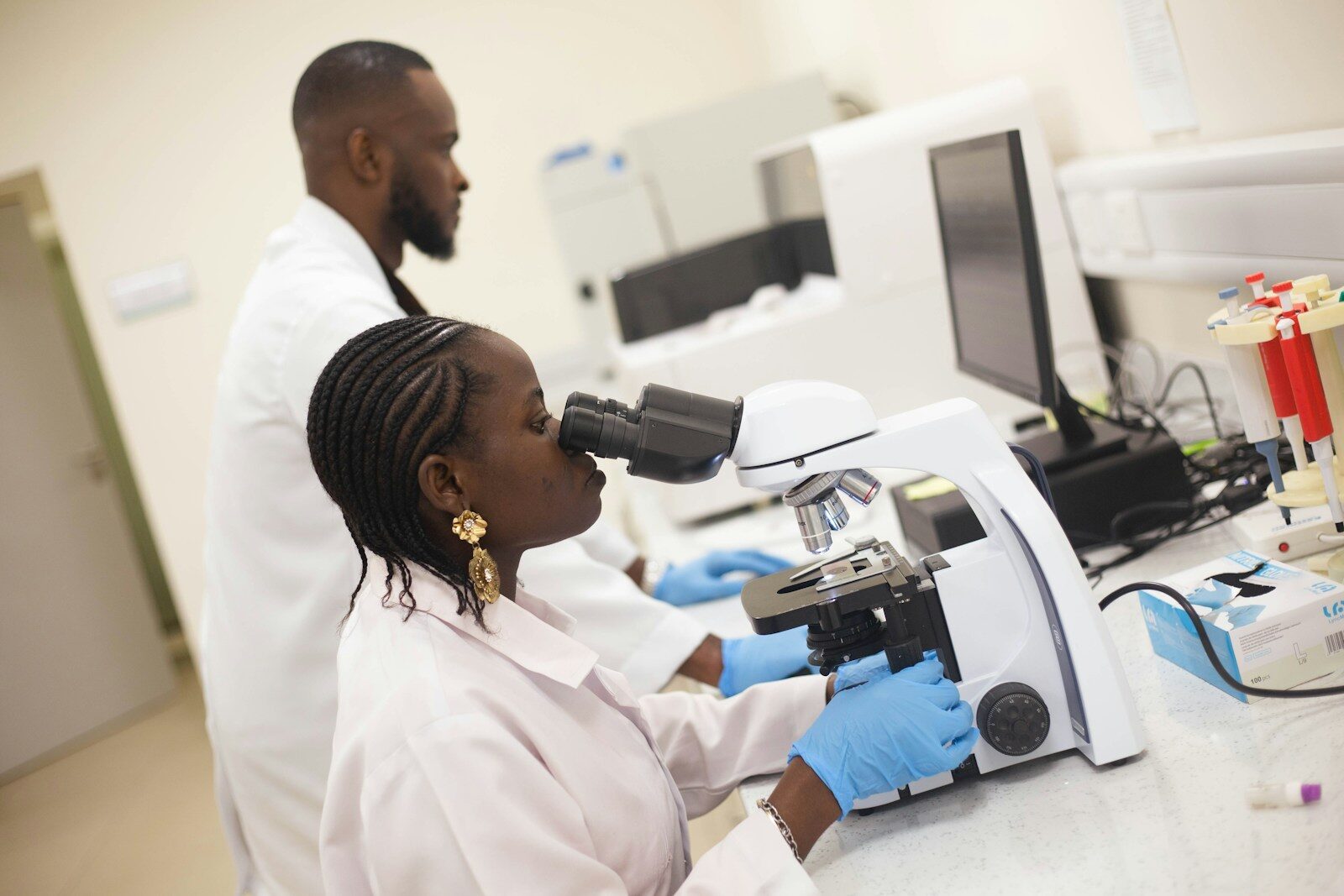 Scientists are working in a laboratory with equipment.